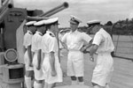Admiral Sir William George "Bill" Tennant KCB CBE MVO DL (2 January 1890 – 26 July 1963). Here he is as Rear (Acting Vice) Admiral W G Tennant, CB, CBE, NVO, talking to the officers on board HMS Mauritius, a Fiji class cruiser. Tennant was the commanding officer of HMS Repulse in 1941 when it was sunk on December 10 by Japanese torpedoes. Photo: Lt. H. A. Mason. Imperial War Museums A 13453A