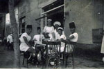 Junior's Mess enjoying a beer wearing fezes at Port Fouad in 1952/54. Image from Keith Butler