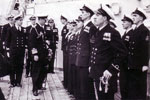 Lord Louis Mountbatten inspects the Division. Lt Elect McGowan behind Lord Louis, Comdr Philamore, C.E.A. Sawyer, far end, Mr Wannicott nearest with P.O. Elect Dinger Bell next to him. Photo from Alan Clements