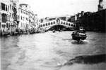 We hired two water taxis for a trip down The Grand Canal, Rialto Bridge, Venice, 1950. Photo from Alan Clements
