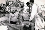 Ken Griffin? doesn't appear to be enjoying the rough shave given during the "Crossing the Line" ceremony on July 22, 1955. Picture kindly submitted by Janet Kirkham, niece of Sick Berth Attendant Ken Griffin who served on HMS Gambia's 1955/56 commission.