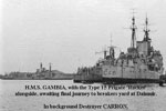 HMS Gambia with the type 15 frigate, HMS Rocket alongside awaitingthe final ourney to the breakers yard at Dlmuir. In the background is the destroyer HMS Carron.