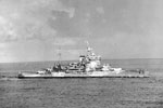 HMS Warspite during operations round Madagascar. The force left Colombo on April 24, 1942 and put into the Seychelles on May 1. The Fleet Air Arm carried out extensive searches and patrols over a wide area during the operation. The covering force then put into Mombasa on May 10 after the operation was concluded. Two ships of the force can be seen in the distance. Photo: Lt. D. C. Ouids. Imperial War Museums A 9701