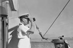 Admiral Sir James Somerville, C in C Eastern Fleet, watches operations from the bridge of HMS Queen Elizabeth. Operation Cockpit against Sabang, April 19, 1944. Photo: Lt. C. Trusler. Imperial War Museums A 23479