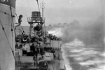 Destroyers firing broadsides on Sabang as they withdraw from the harbour. Operation Crimson, July 25, 1944. Photo: Lt. C. Trusler. Imperial War Museums A 25115