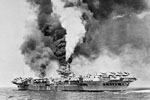 The aircraft carrier HMS Formidable on fire after being struck by a Kamikaze off Sakishima Gunto in May 1945. As seen from HMS Victorious. HMS Formidable was hit by a Kamikaze on May 4 and again on May 9. Imperial War Museums A 29717