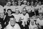 Christmas Day, 1950. This is 28 & 30 Seaman's Mess, all Radar men. John Harris, the only person who's name I know in this photo is in the tall hat on the right, next to "Gur" the Arab. Photo from my dad's albums.
