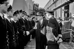 Mr Jordan, High Commissioner of New Zealand, attending the formal handing over of HMS Gambia in Liverpool, October 3, 1943. Here Mr Jordan is talking to officers of the ship. Photo: Lt. C. H. Parnall. Imperial War Museums A 19583