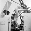 AB Thomas Amsden of Southampton putting final polish on his Bofors Gun mounting before visitors come on board HMS Sheffield on June 11, 1953. Imperial War Museums A32583