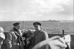 Rear Admiral S. S. Bonham-Carter, CB, CVO, DSO, Commanding 18th Cruiser Squadron, whose flag ship HMS Edinburgh had the job of welcoming the American Task Force Mid-Atlantic under the command of Rear Admiral R. G. Griffen, seen on the bridge of HMS Edinburgh with his Flag Captain, Captain H. W. Faulknor. April 3-4, 1942. Photo: Lt. R. G. G. Coote. Imperial War Museum A 9242