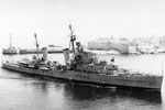 HMS Phoebe entering Grand Harbour, Malta, proudly displaying the 'Cock of the Fleet' on her 'B' turret after winning it at Marmarice, Turkey, in July 1950. Photo from Terry Bateman.