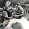 On Mrs. Bullock's farm at Nanyuki near Nairobi, Kenya in June 1955. This is right on the equator. Keith Butler is holding the dog on the left. Steve Bentley in on the right. Image from Keith Butler