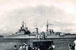 Leaving Trincomalee, Paying Off pennant flying. The length of the Paying Off pennant is traditionally one foot for every year of the ship's service in 1955/56. Image from Keith Butler