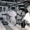 Christmas Day 1955 – Captain Evershed visits the Chief's Mess. Keith Butler was a mess-man. Image from Keith Butler