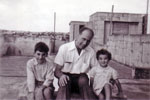 Electrical Artificer Alan Clements baby sitting Reverend Bob Pope's children, Patrick and Hilary. Photo from Alan Clements
