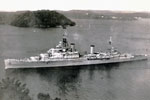 HMS Gambia leaving Trincomalee for home with Paying Off pennant flying, 1956. The length of the Paying Off pennant is traditionally one foot for every year of the ship's service. Photo kindly submitted by Janet Kirkham, niece of sick berth attendant Ken Griffin