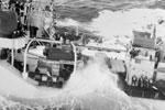 The Daring class destroyer HMS Dainty shipping a heavy sea while steaming alongside RFA Wave Master during a refuelling operation in the Bay of Biscay on January 12, 1957. Imperial War Museums A 33718