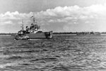 HMS Gambia and HMS Dauntelss, a Danae class cruiser, with troops going ashore from the assault ships in landing craft, capturing Tamatave, Madagascar's principal port, September 18, 1942. Photo: Lt. D. C. Oulds. Imperial War Museums A 12375