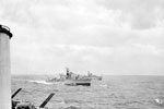 Mediterranean fleet demonstration for the Emperor of Ethiopia. October 1954, on board the cruiser HMS Gambia, sailing from Malta to the United Kingdom. The Emperor of Ethiopia witnessed a demonstration by ships of the Mediterranean fleet which took place in heavy weather. Imperial War Museum A 33029