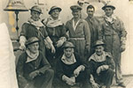Special after deck fire party, ready at action stations. Pictured are (back row) Stoker Roberts, Stoker Austin, Sharpe, Brown, Stoker Stephens. Front row: Simmonds, A.B. Glasson, McNeil. NMRNZN - AAI0064