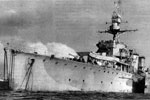 HMS Dragon, a Danae class cruiser, was built in December 1917 and scuttled near France in July 1944. In January 1943, she was transferred to the Polish Navy and renamed ORP Dragon. This photo was taken in May 1944