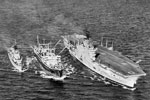The Aircraft Carrier HMS Ark Royal, the Royal Fleet Auxiliary Wave Master and the Daring class frigate, HMS Dainty steaming in close formation during a refuelling operation in the Mediterranean on January 16, 1957. Imperial War Museums A 33716