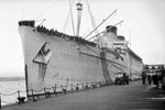 SS Mauretania carrying soldiers and civilians from the Far East, alongside Princes Landing Stage in Liverpool docks. Photo: Cptn. George Dallison. Imperial War Museums H 42406