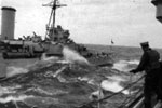 HMS Kenya from HMS Sheffield. A jackstay is being prepared between the two ships. Photo from Ray Holden.