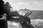 The American carrier USS Wasp flying-off her aircraft as seen from HMS Edinburgh. The task force was under the command of Rear Admiral R. G. Griffen. April 3-4, 1942. Photo: Lt. R. G. G. Coote. Imperial War Museum A 9236