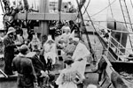 Grace Line Steamer passengers crossing the equator for first time were dunked in a canvas tank of water on ship's deck. March 3, 1923. Field Museum Library