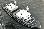 HMS Gambia's motorboat being hoised aboard in 1952. Photo from my dad's albums.