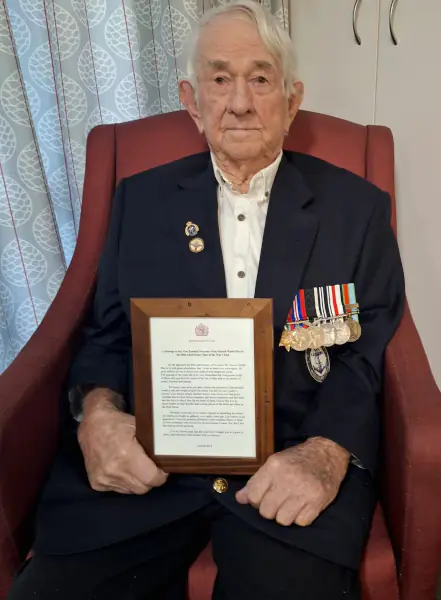 Ken Gordon with his letter from King Charles