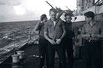 Erik Gaze, Ian Langford, Bill Hartland & Pete Westaway on the upper deck somewhere in the deepest darkest Indian Ocean. Photo provided by Michael Hutton