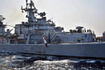 Tranferring stores and personnel between ships using a jackstay has been done for cnturies. This is a ship of the Indian Navy practicising it on November 19, 2015. Photo: Indian Navy. Wikimedia Commons CC BY 2.5 IN