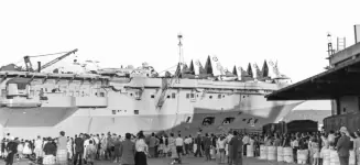 HMS Albion. The planes are Hawker Sea Hawk FGA.6 fighter-attack aircraft. The helicopers are Whirlwind HAS.7 anti-submarine helicopters