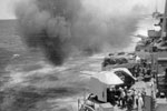 X turret bombarding Kamaishi on August 9, 1944. This photo kindly donated to the HMS Gambia Association by Peter Maben, son of Jack Maben who served on HMNZS Gambia as a Royal Marine.