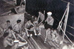 Relaxing on the deck of HMS Cook. Photo from Denys Powell, kindly submitted by Anita Neads.