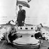 AB David Mann of Newcastle, and Boy Michael Tilley of Portsmouth, touching up the Capstan under the supervision of PO Desmond Sparrow of Coventry on HMS Sheffield on June 11, 1953. Imperial War Museums A32581