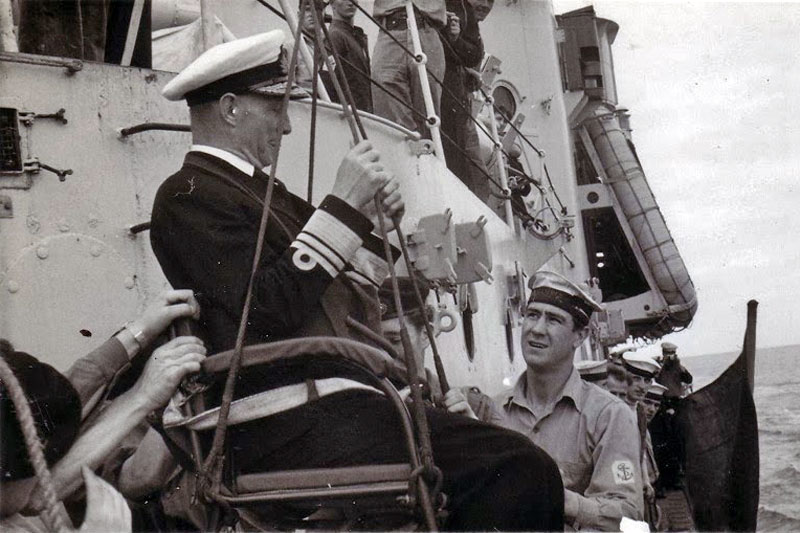 Slim Welsby assisting with a jackstay transfer of an admiral in the Mediterranean Sea in 1950